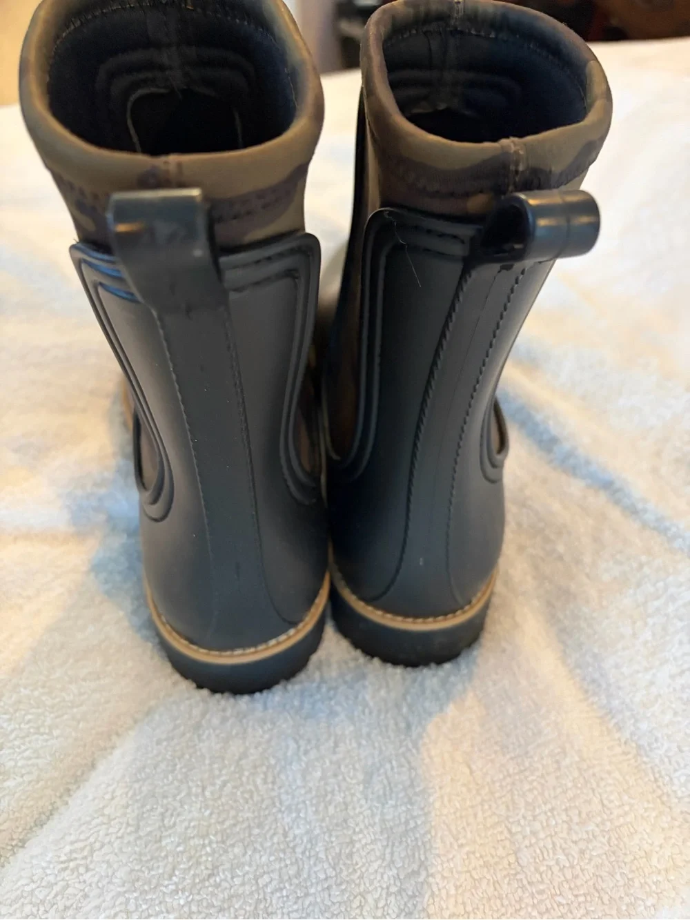 Bernardo Black Ankle Rain Boots with camo accents.